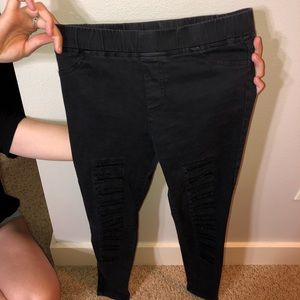 black distressed, ripped down the leg jeans